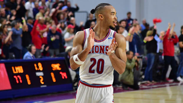 Feb 9, 2023; Los Angeles, California, USA; Loyola Marymount Lions guard Cam Shelton (20) reacts against the St. Mary's Gaels in the closing seconds of overtime at Gersten Pavilion.